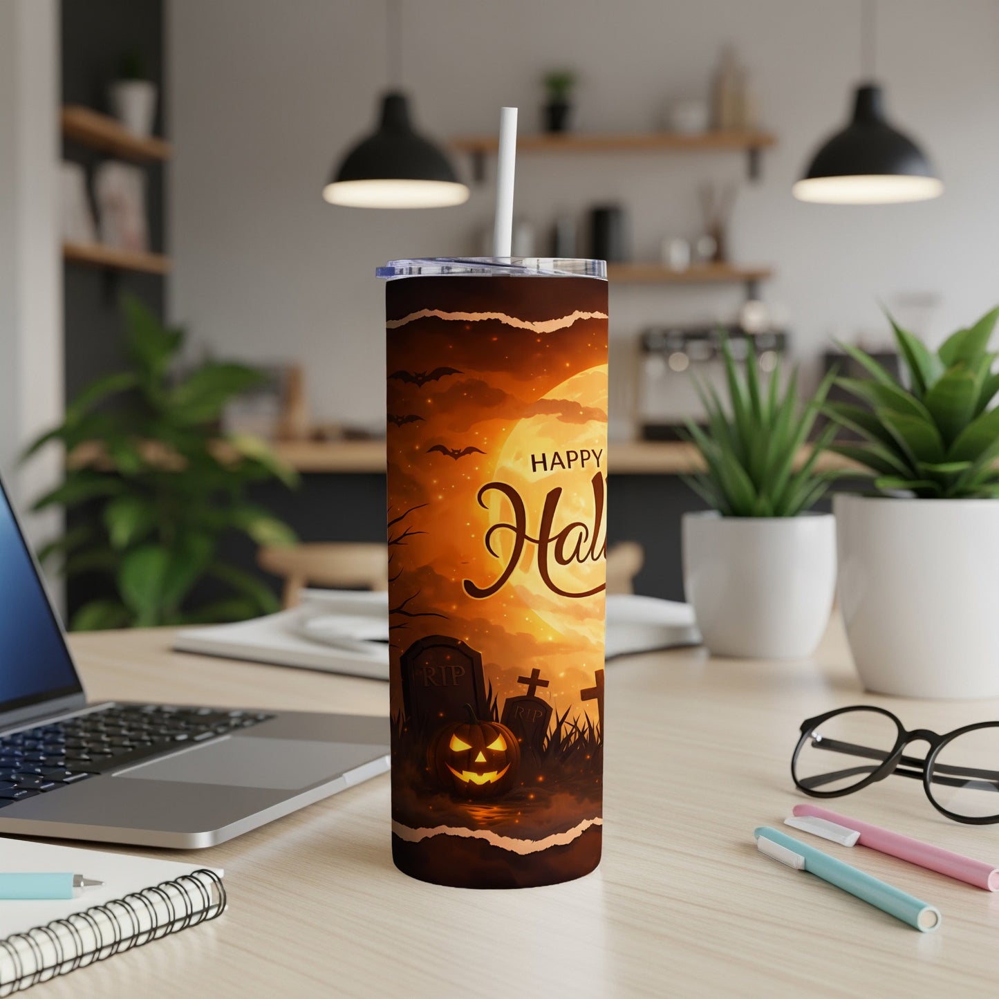 Halloween tumbler with jack-o'-lantern, gravestones, and bats against a full moon.