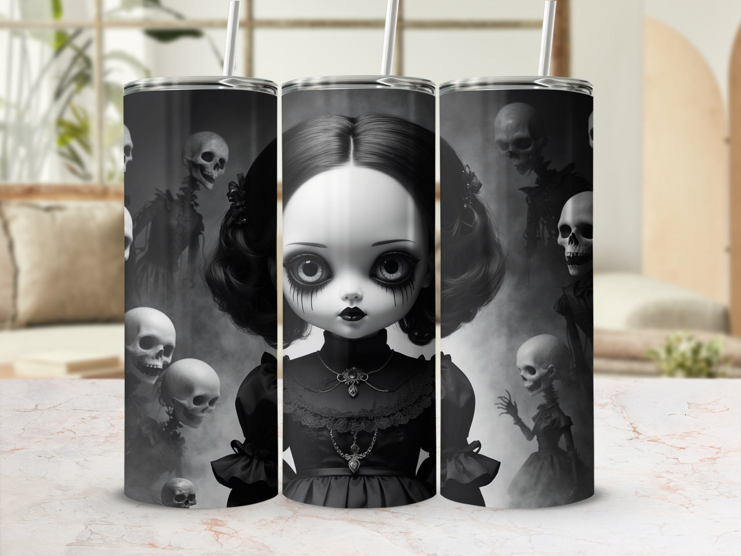 Gothic doll with skulls and spooky figures on a tumbler.
