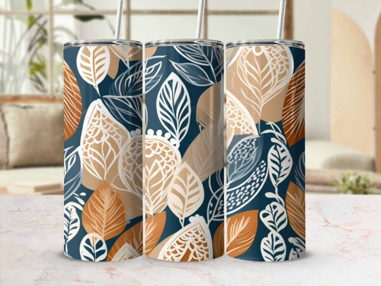 Three tumblers with a repeating pattern of blue, tan, and cream leaves.