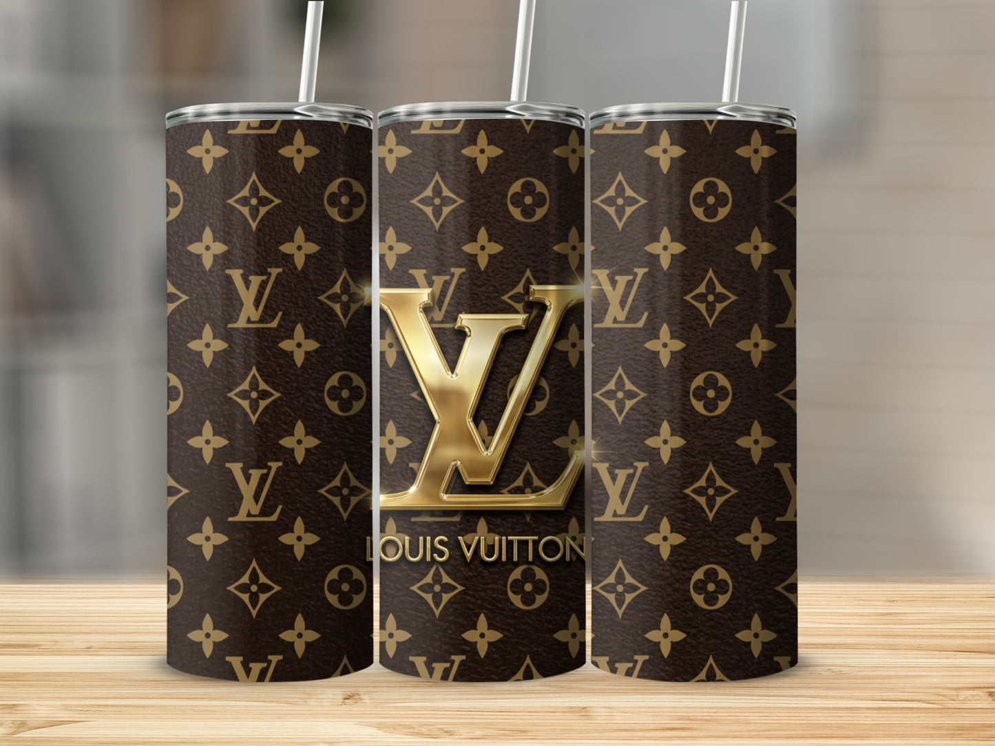 Three tumblers with Louis Vuitton logo and repeating monogram pattern.