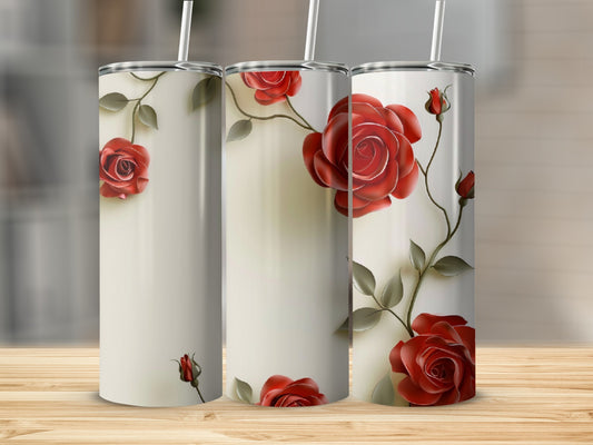 Three tumblers with red roses and green leaves on a wooden surface.