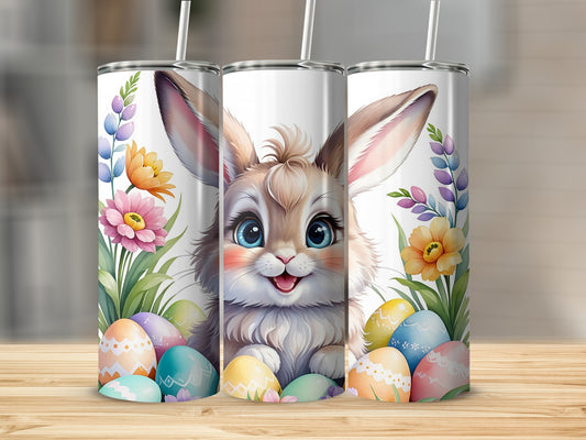 Easter bunny and decorated eggs surrounded by spring flowers.