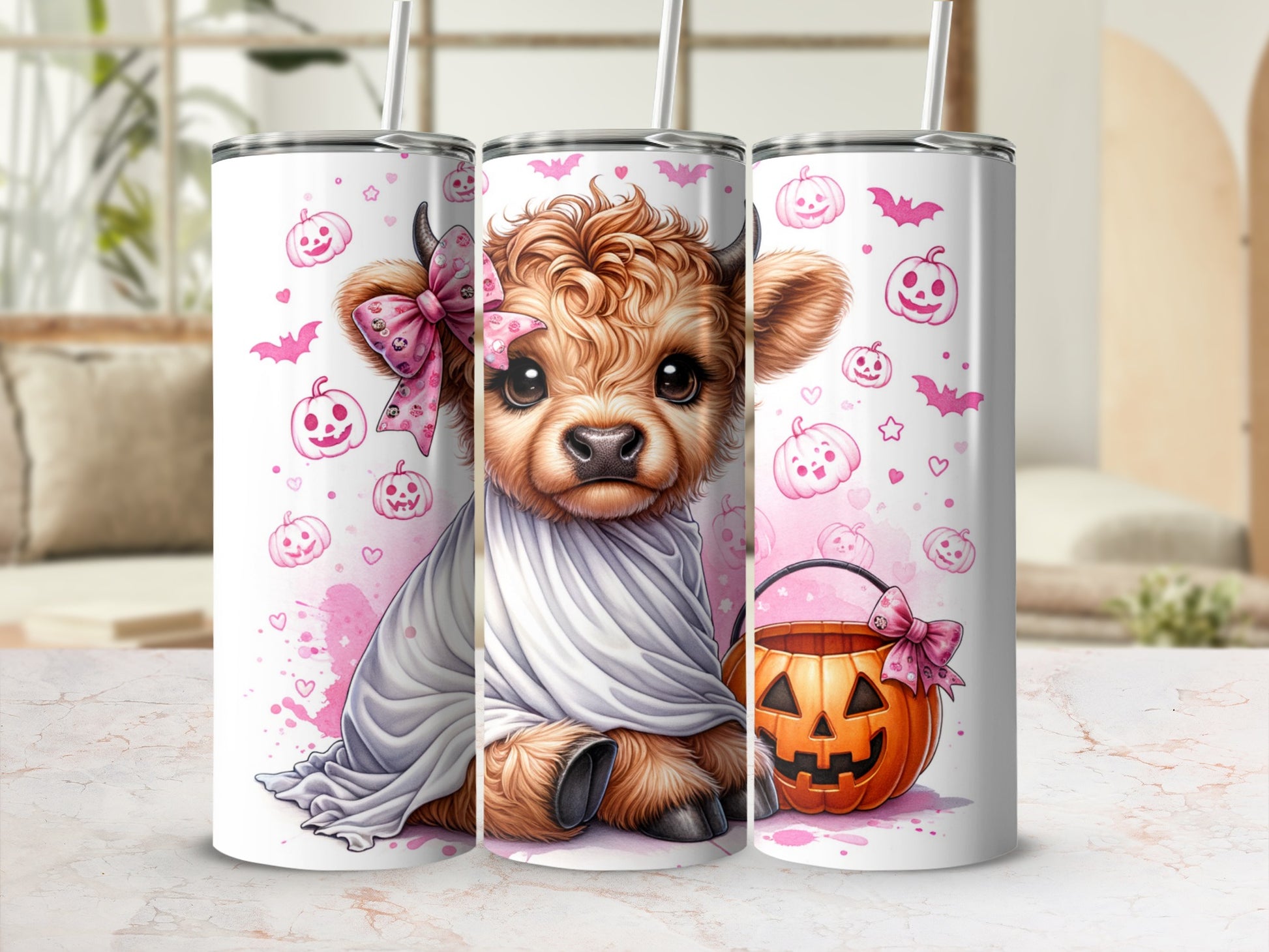 Three tumblers featuring a cute, fluffy Highland cow in a ghost costume and Halloween pumpkins.