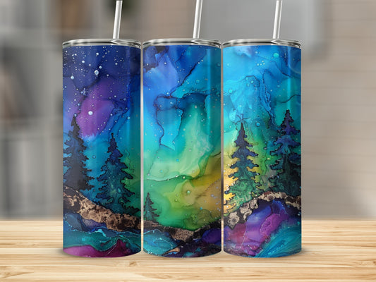 Three tumblers with aurora borealis, pine trees, and gold accents.