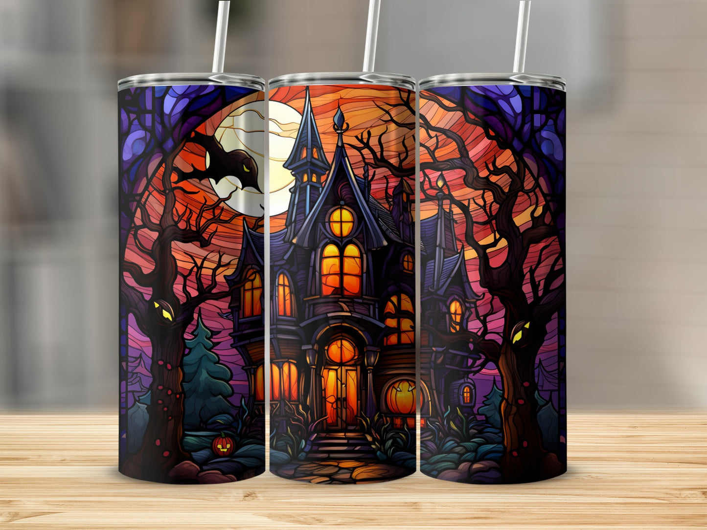 Haunted house with spooky trees and moon on a tumbler.