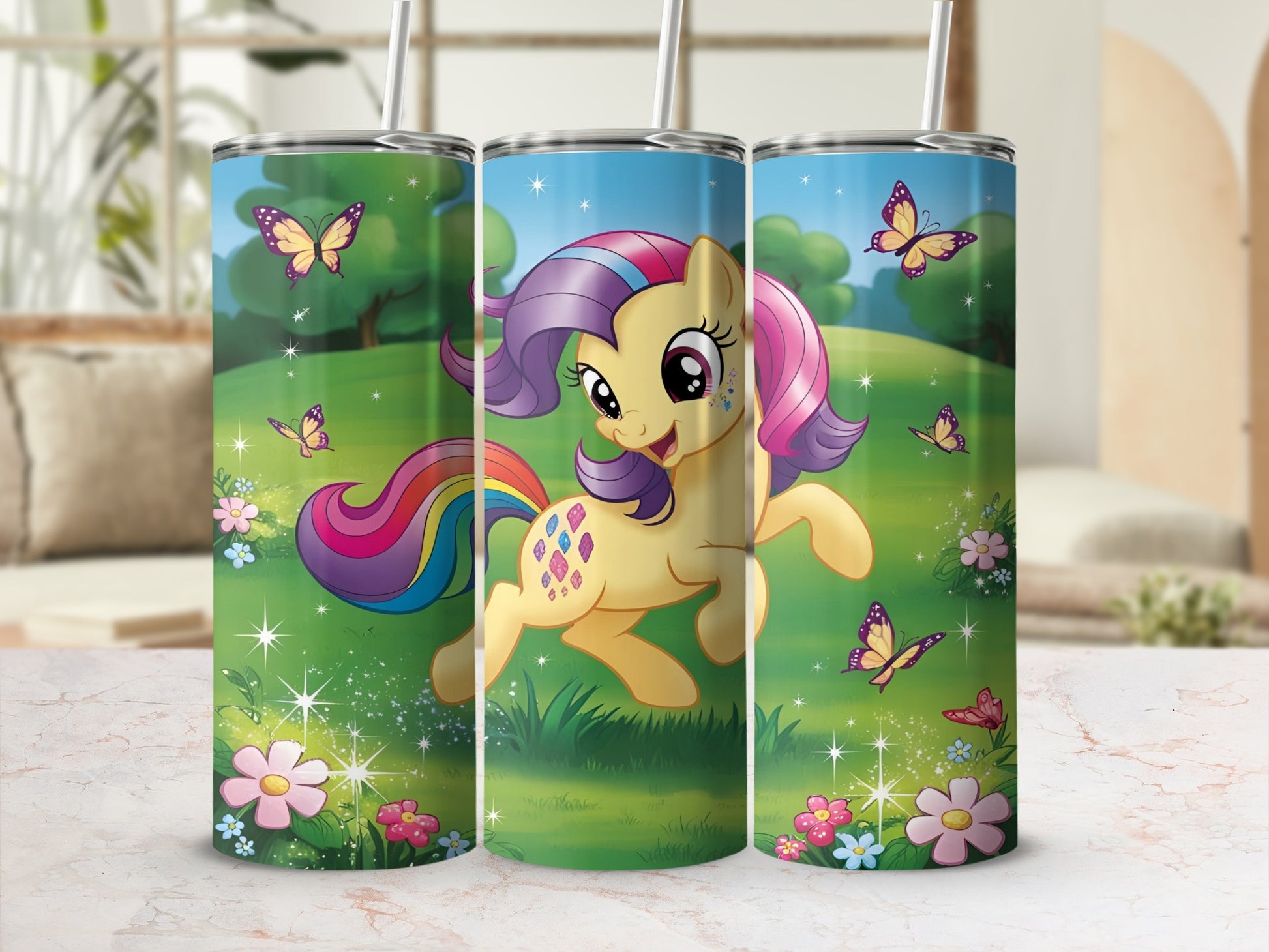 Yellow pony with rainbow mane and tail on grassy field with flowers and butterflies.