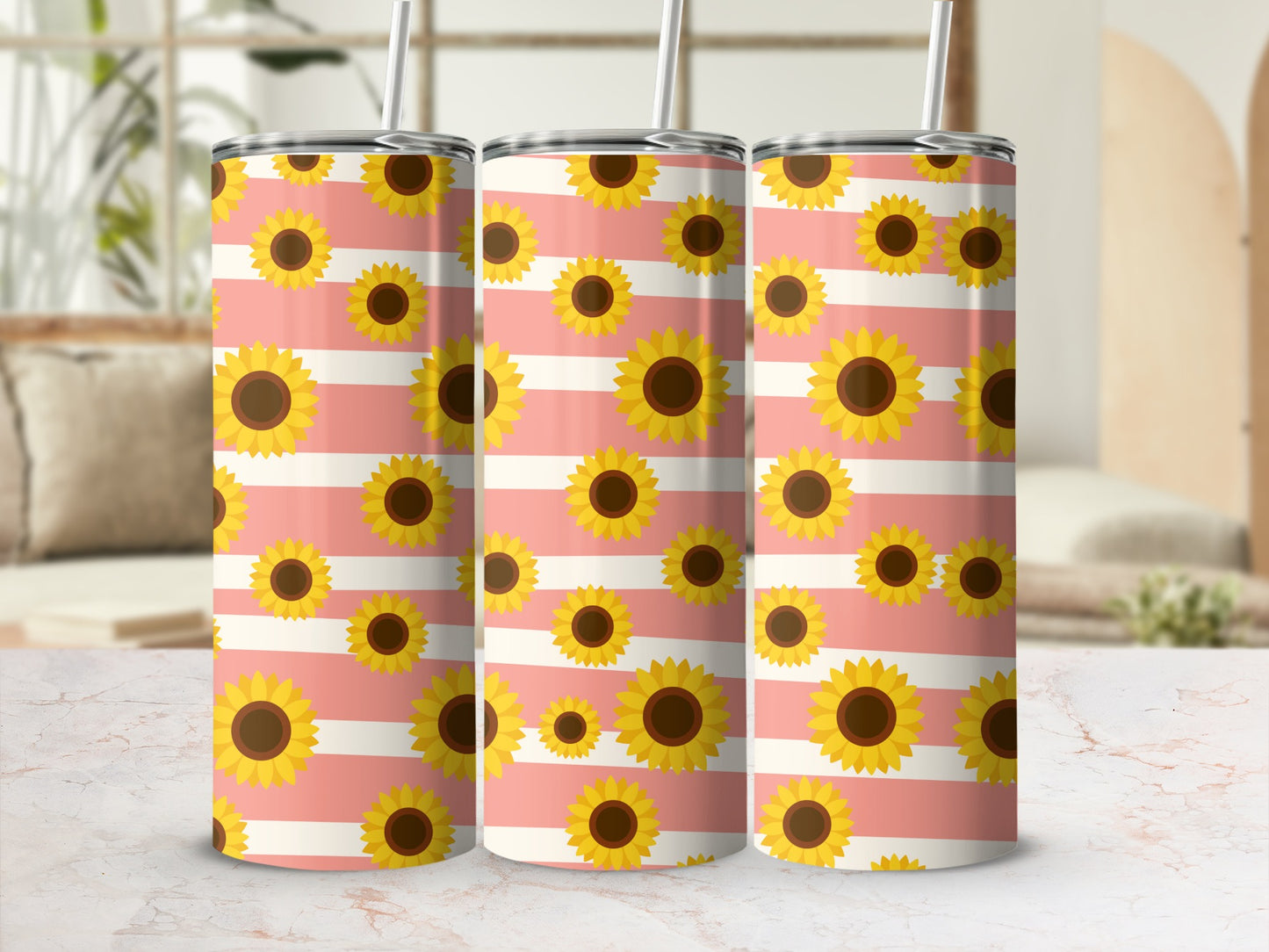 Three tumblers with a pink and white stripe pattern and scattered sunflowers.