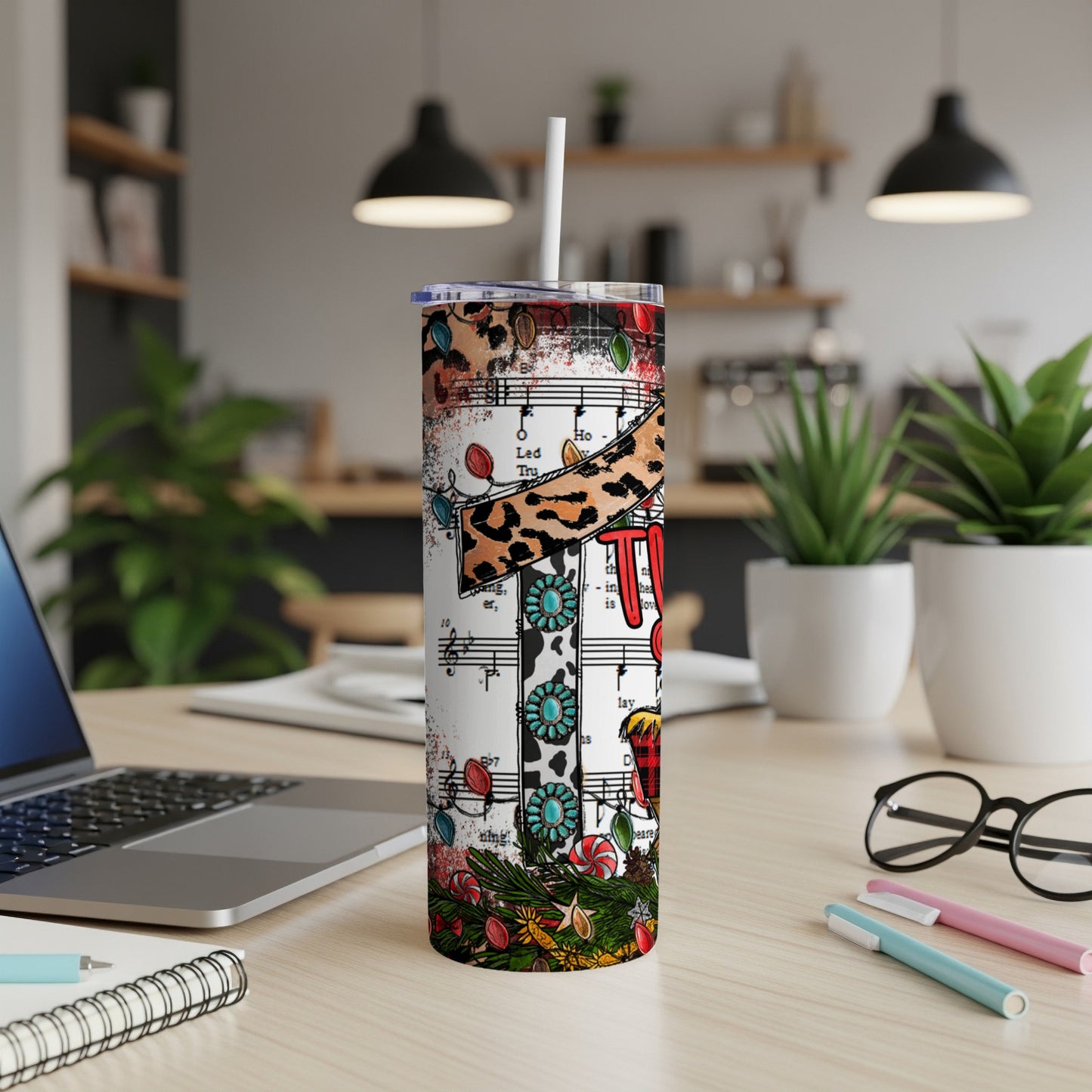 Tumbler with Christmas lights, musical notes, and red plaid "Ho Ho Ho" text.