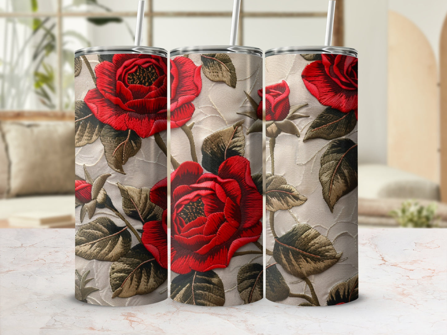 Three tumblers featuring red roses embroidered on a textured background.