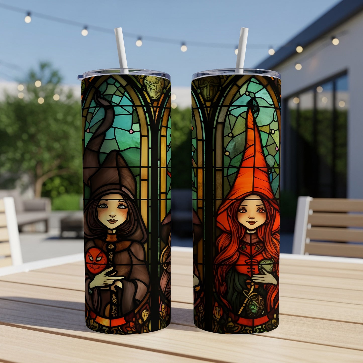 Two witches, one with a pumpkin, depicted in stained glass style on tumblers.