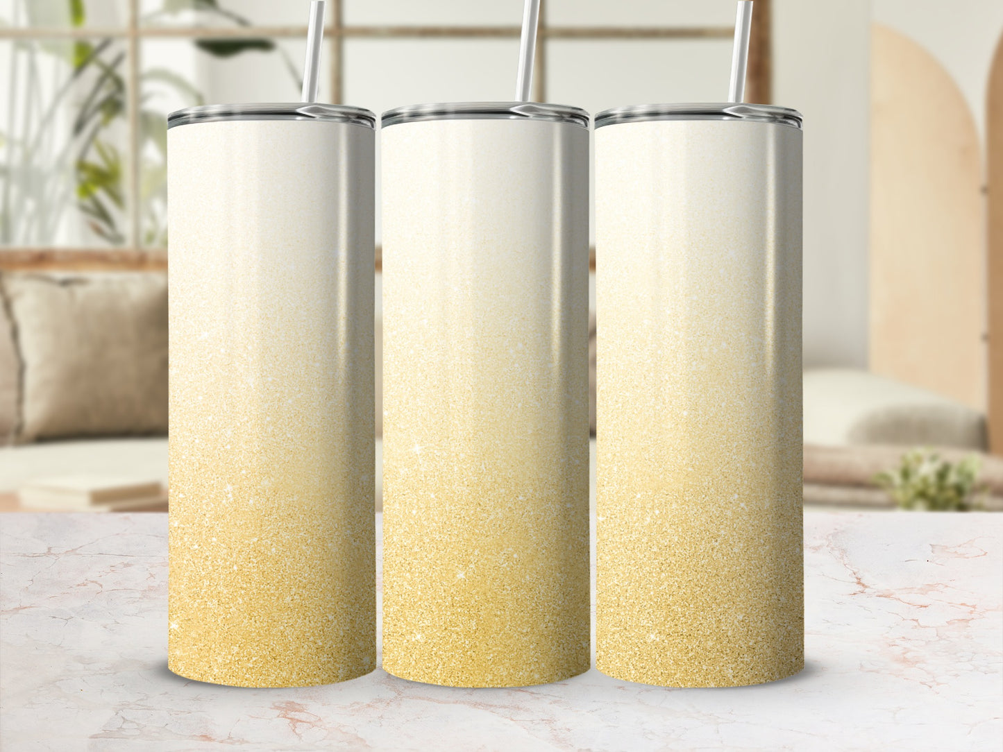 Three tall tumblers with a white to gold glitter gradient design.