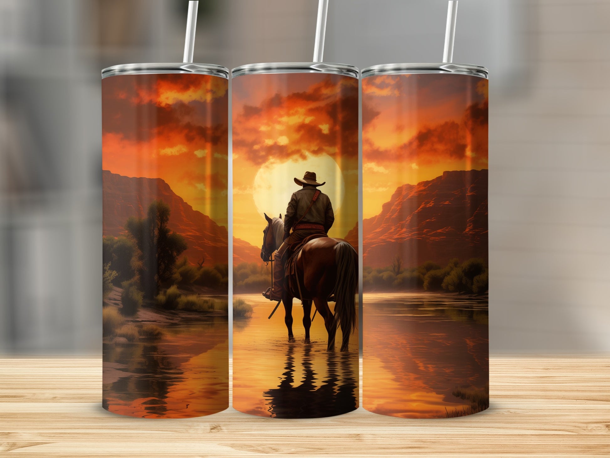 Cowboy on horseback in a river with a sunset over mountains.