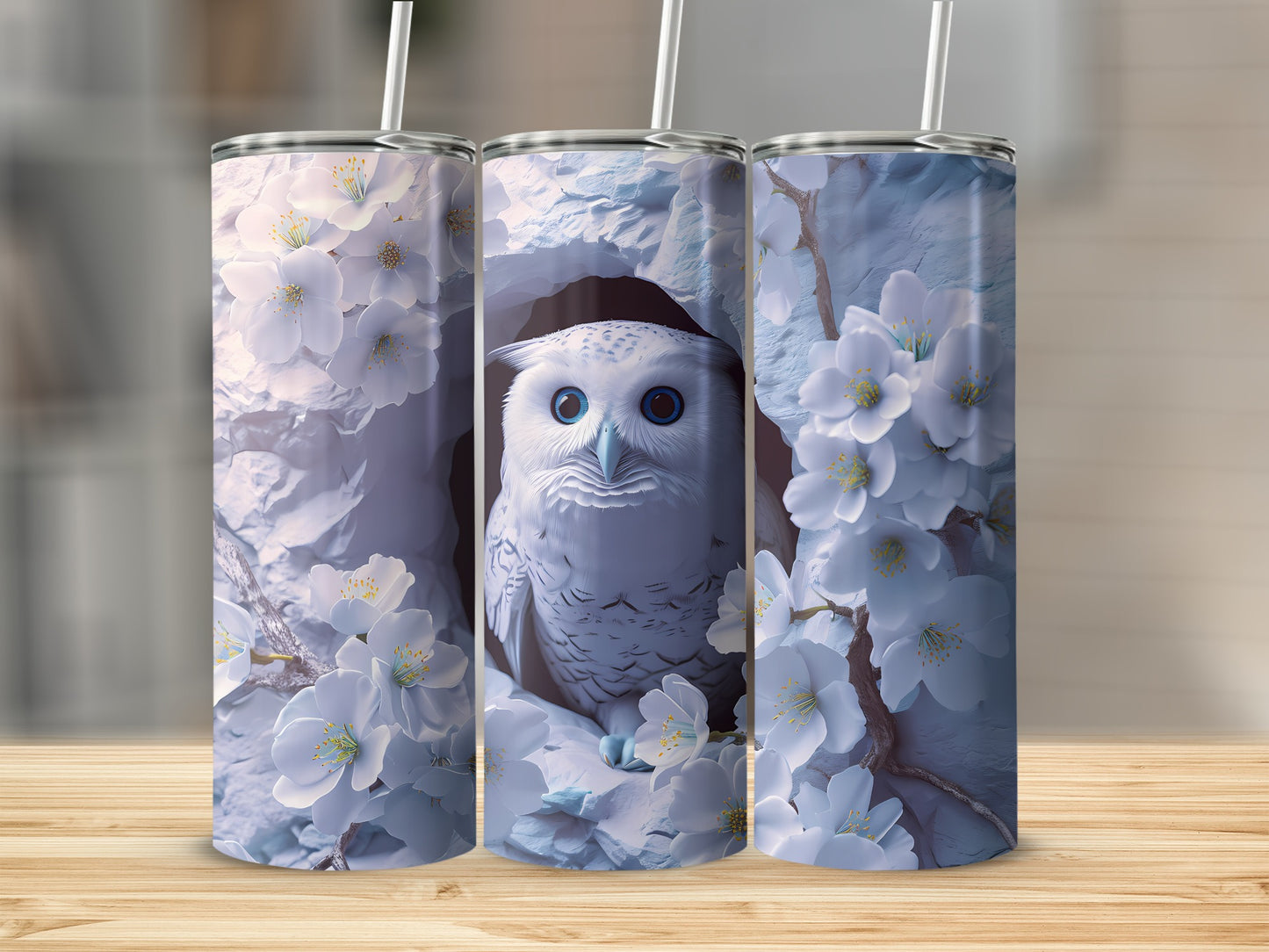 White owl in snow-covered branches with white flowers, on a tumbler.