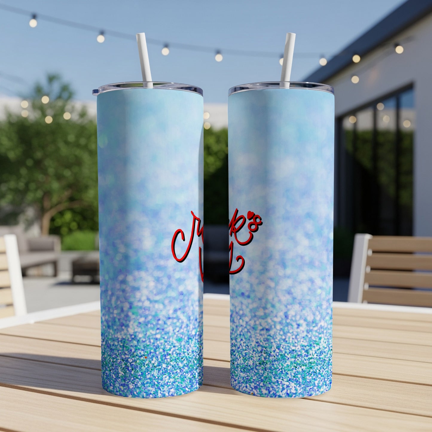 Blue glitter tumbler with "Crazy" text on an outdoor table.