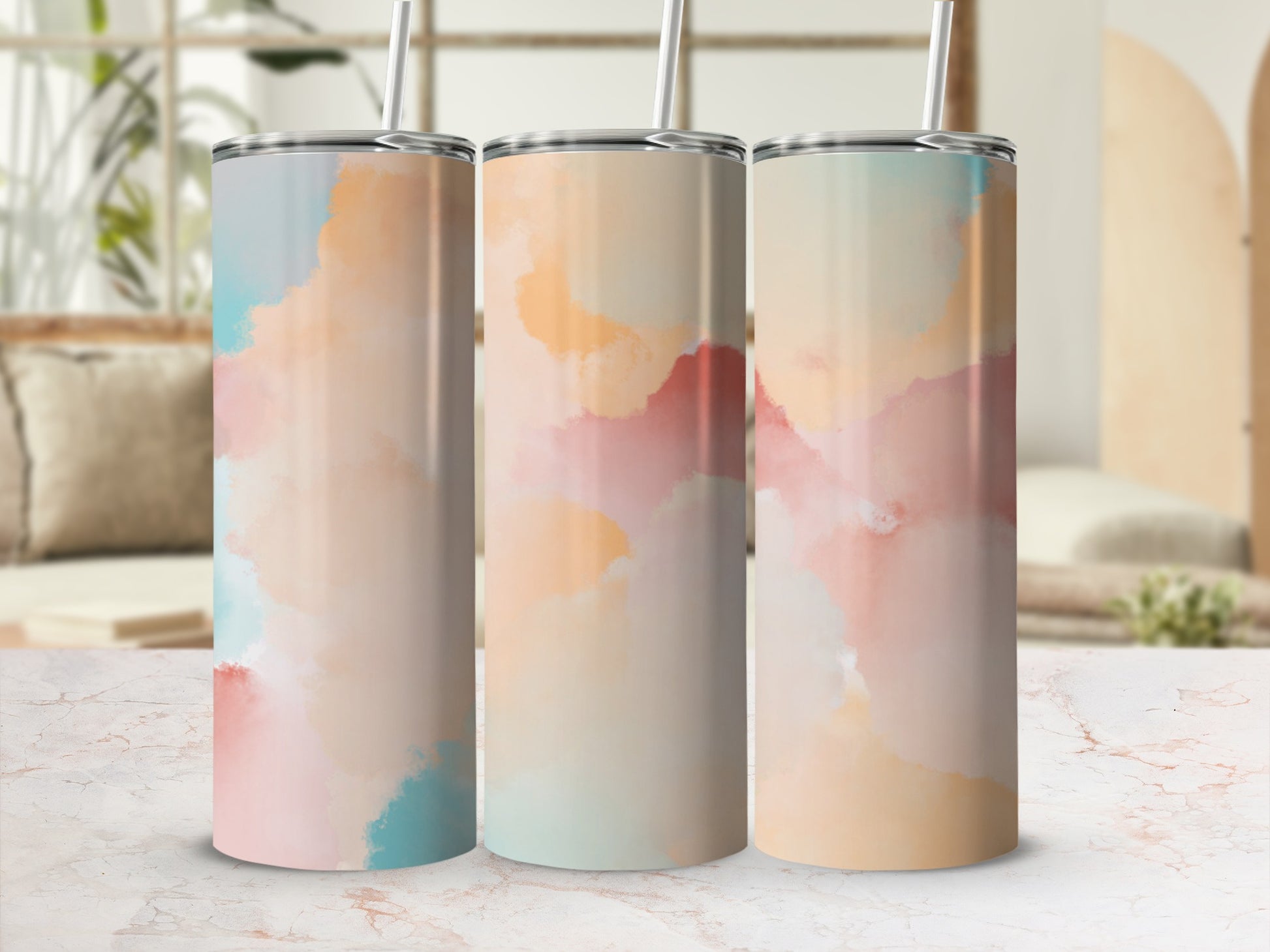 Three tumblers with a watercolor pastel abstract design.