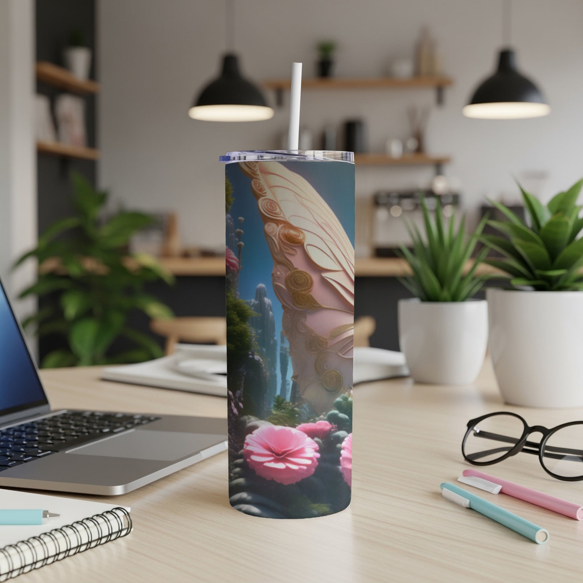 Pink butterfly wing pattern on a tall tumbler with a straw.
