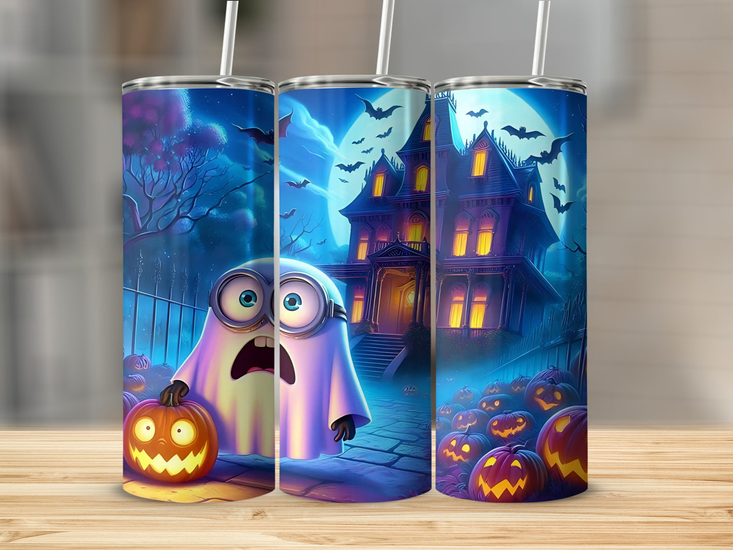 Minion ghost with pumpkin, haunted house, bats, and jack-o'-lanterns on tumblers.