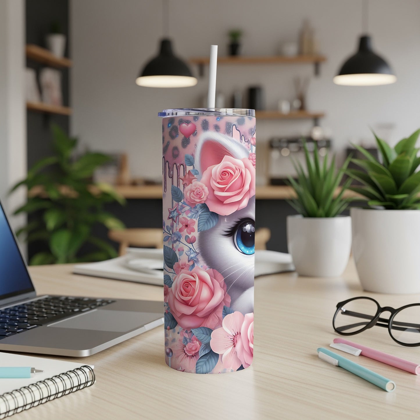 Tumbler featuring a cartoon cat face surrounded by pink roses and floral accents.