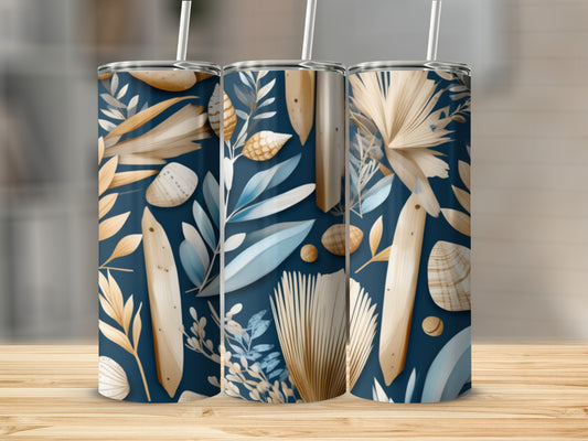 Tumbler with navy blue background and botanical, seashell, and wood grain pattern.