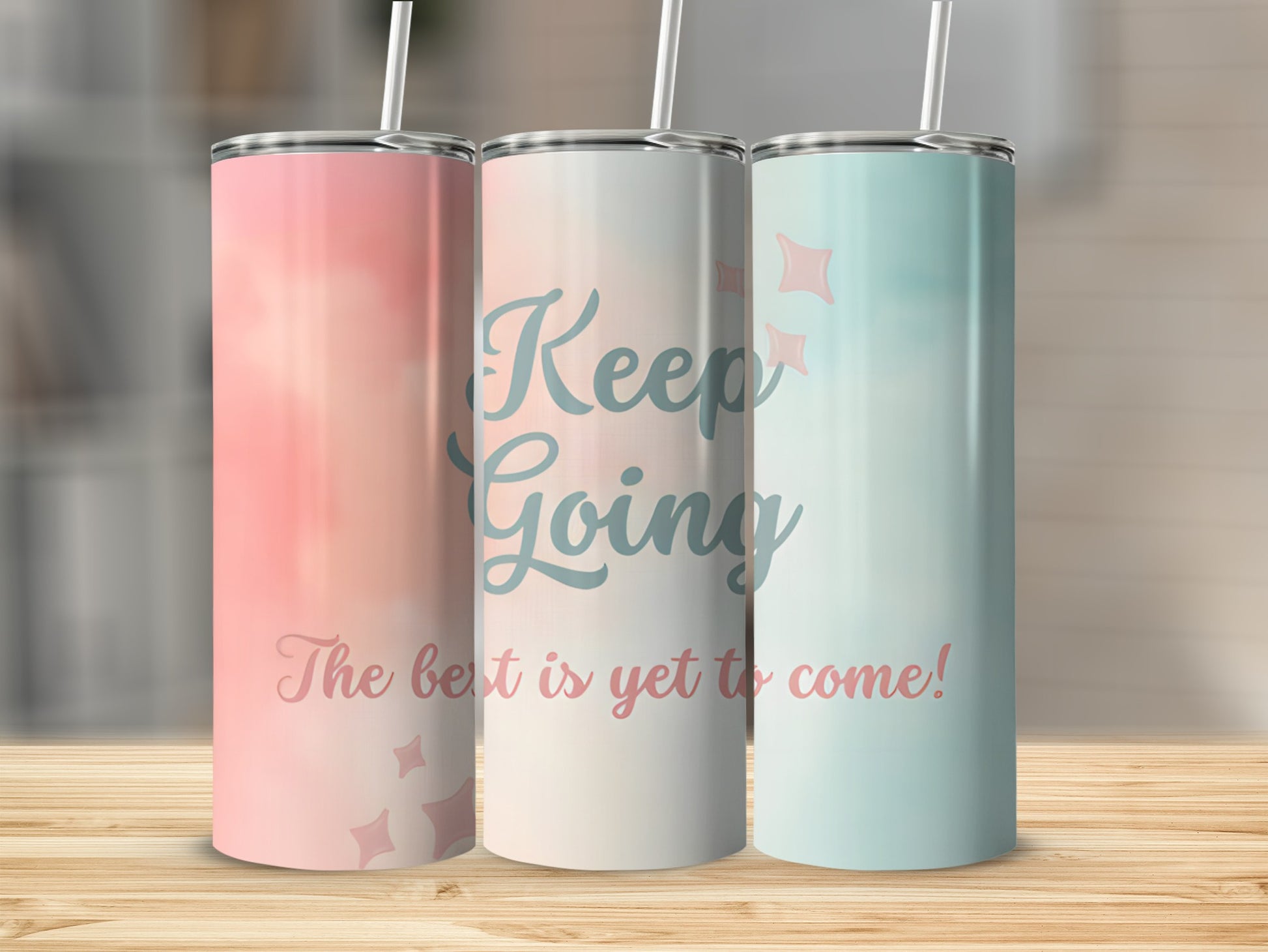 Three tumblers with watercolor backgrounds and motivational text.