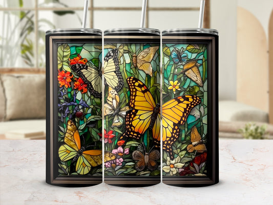 Three tumblers with stained glass-style butterfly and floral designs.