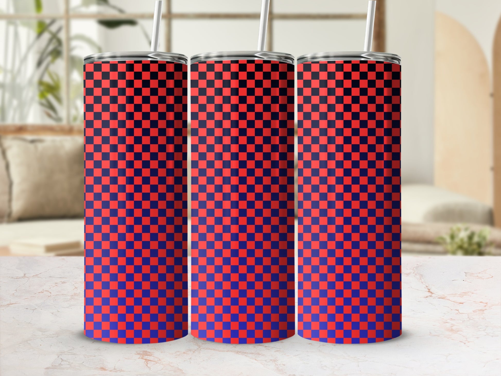 Three tumblers with a red and blue checkered pattern stand on a marble surface.