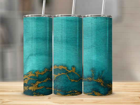Three teal tumblers with gold marble design on a wooden surface.
