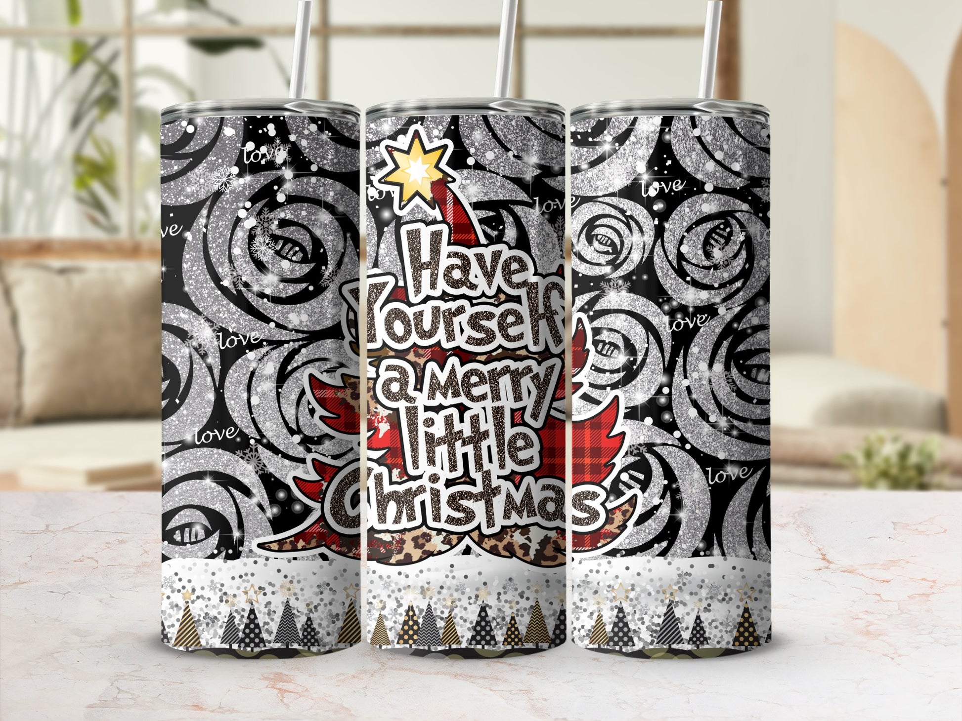 Glittery tumbler with "Have yourself a merry little Christmas" text and festive patterns.