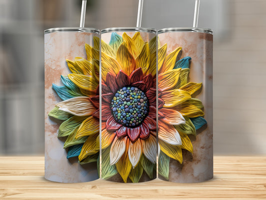 3D sunflower design on a stainless steel tumbler with marbled background.