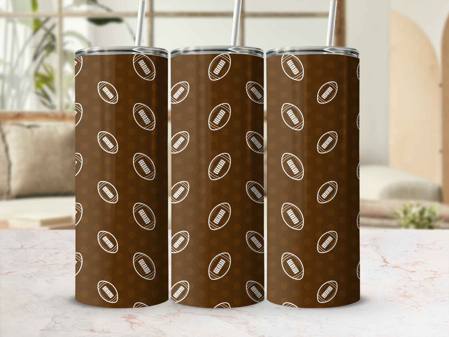 Three brown tumblers with white football and polka dot pattern.