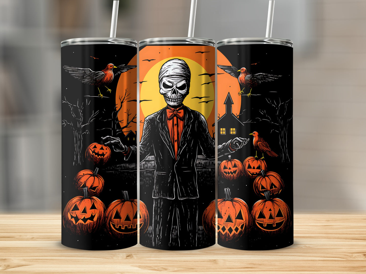 Halloween tumbler with skull, pumpkins, crows, and a haunted house scene.