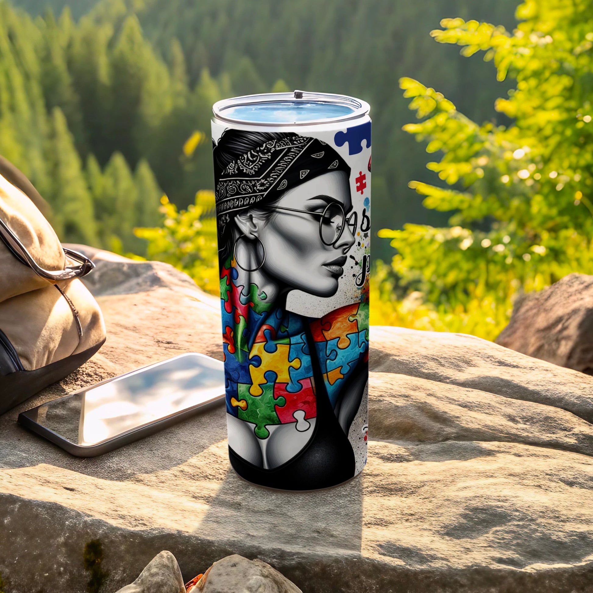 Tumbler with woman and autism puzzle piece design.