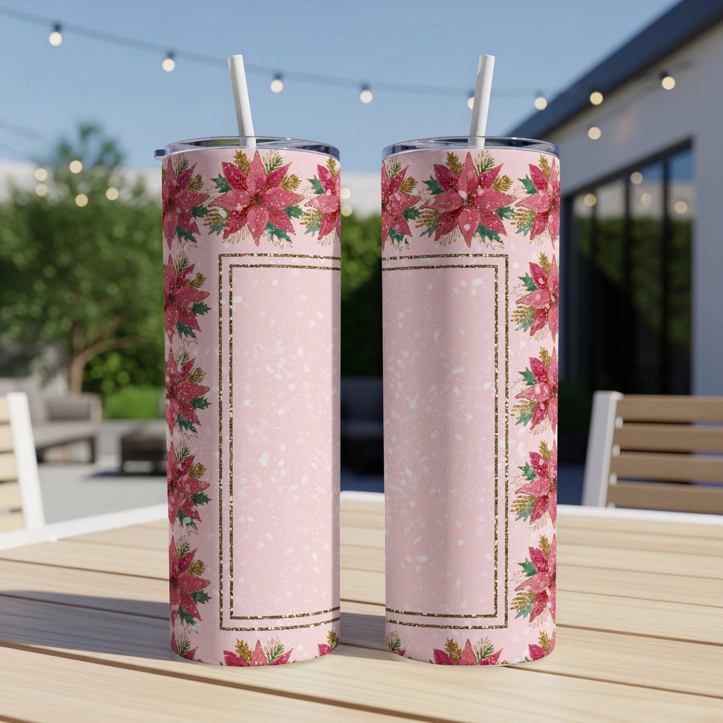 Two pink tumblers with poinsettia floral design and gold glitter border.