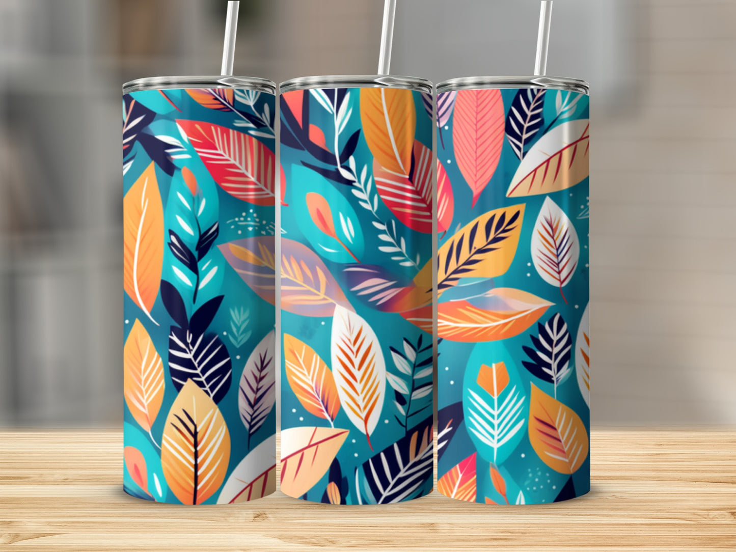 Three tumblers with a colorful abstract leaf pattern.