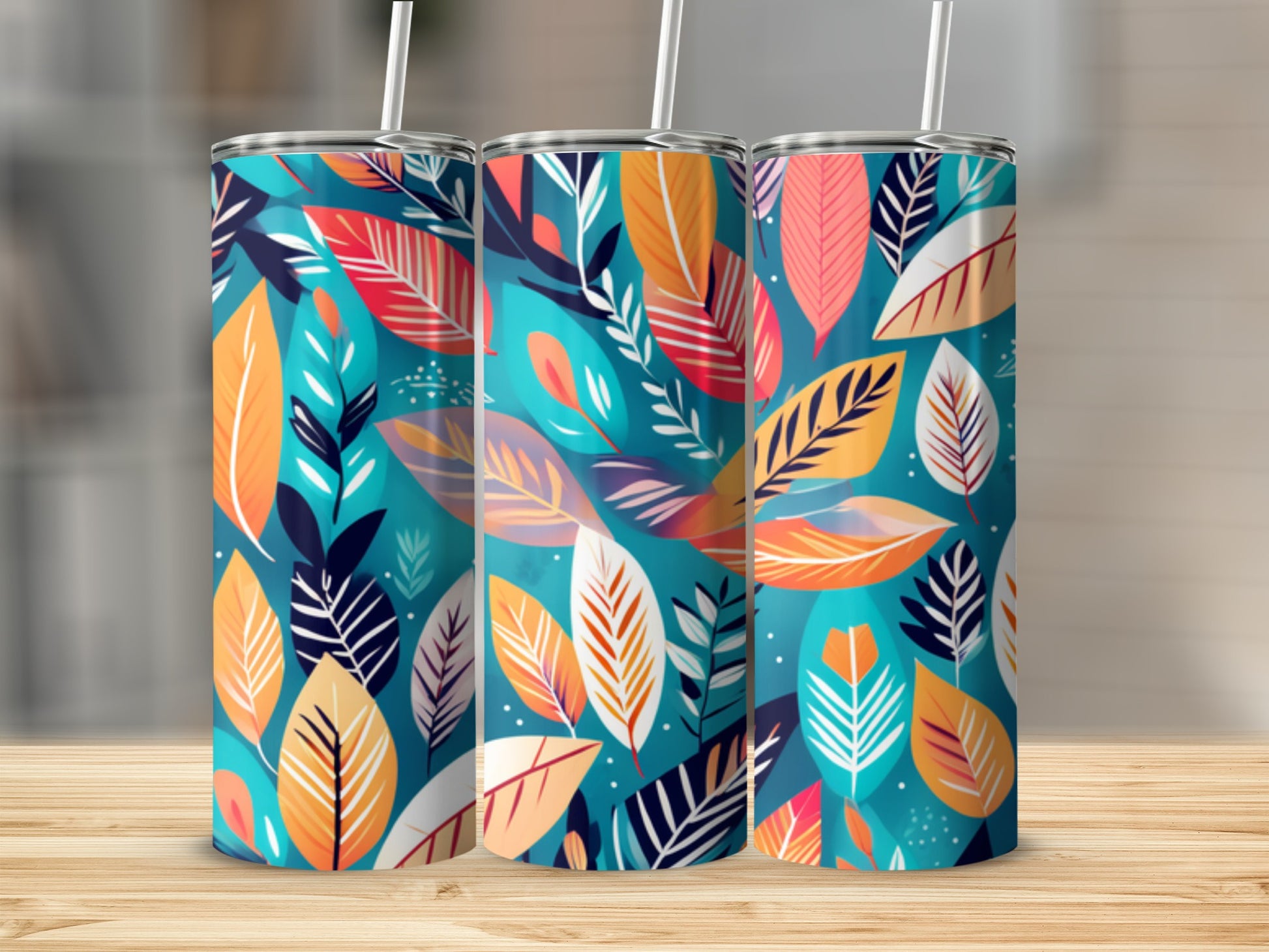Three tumblers with a colorful abstract leaf pattern.