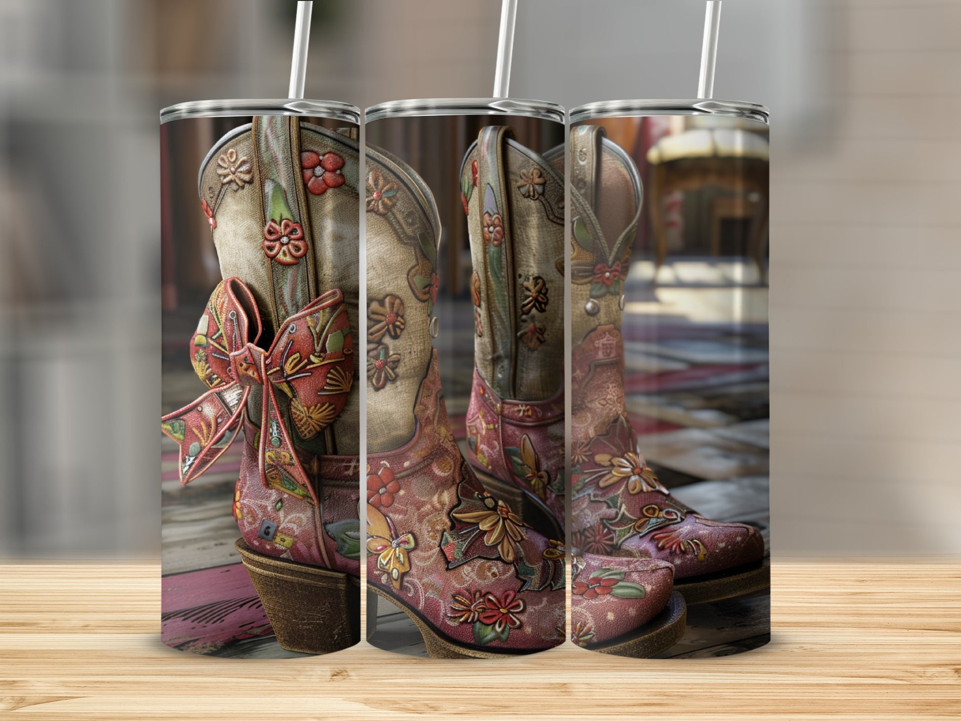 Cowboy boots adorned with floral embroidery and a bow, presented on a wooden surface.