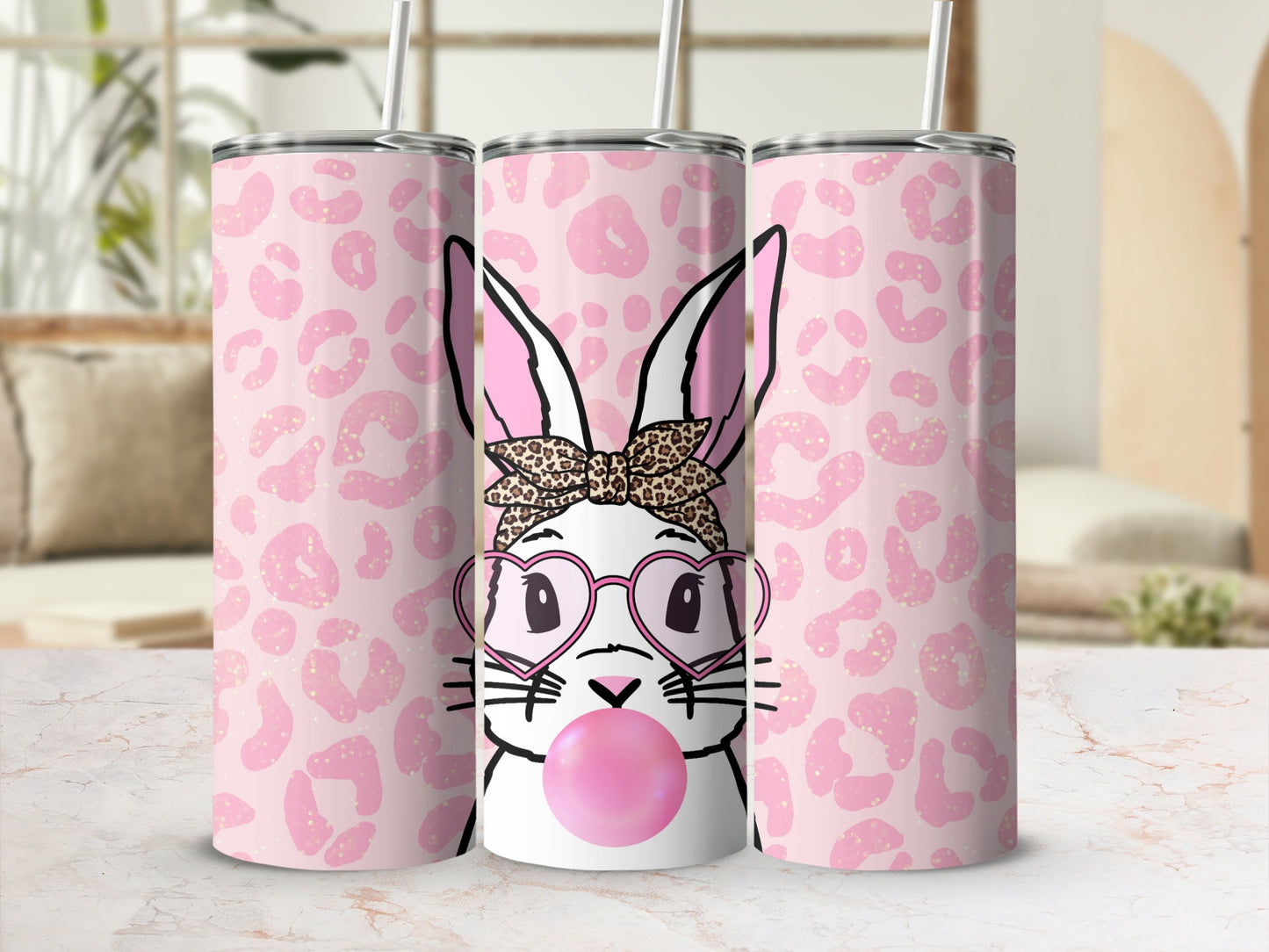 Pink leopard print tumbler with a cartoon bunny blowing bubblegum.