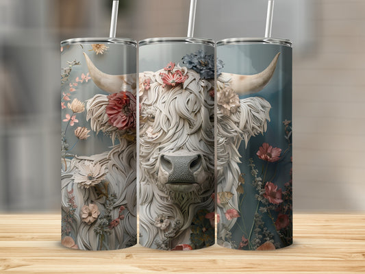 Floral Highland cow artwork on three stainless steel tumblers.