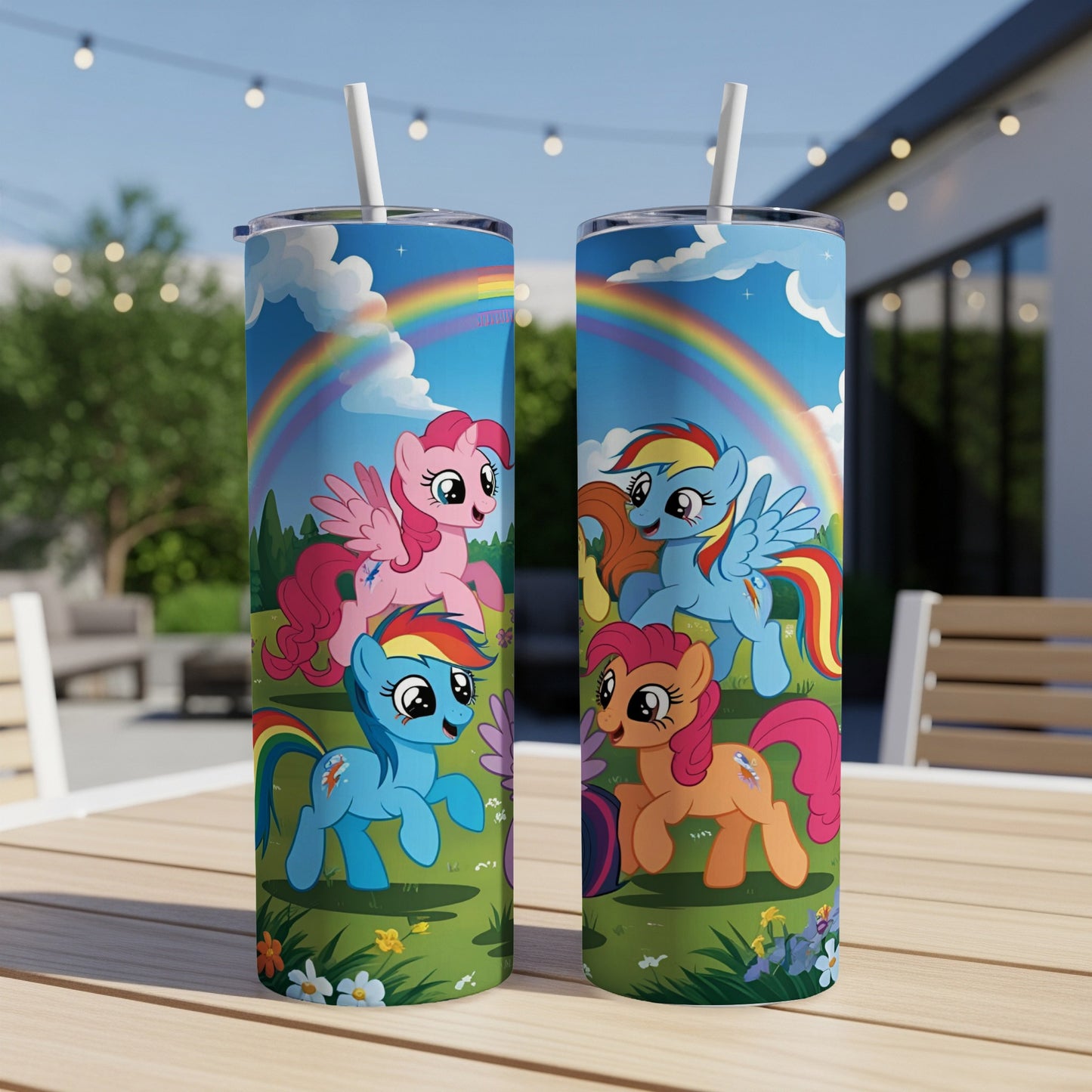 My Little Pony characters on a green field with a rainbow and blue sky.