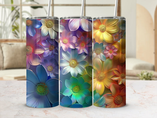 Three tumblers with colorful floral patterns in a gradient of blues, greens, and yellows.
