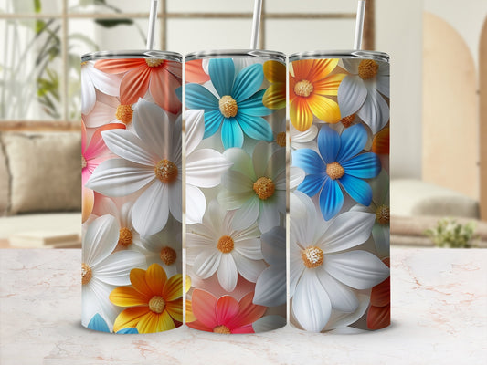 Three tumblers with colorful floral designs.