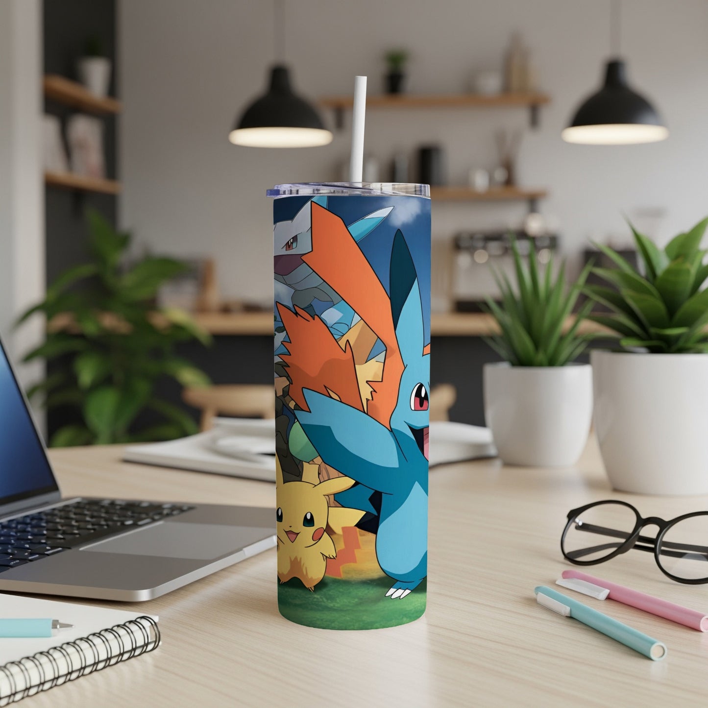 Pokémon characters Pikachu, Feraligatr, and Charizard on a blue tumbler.