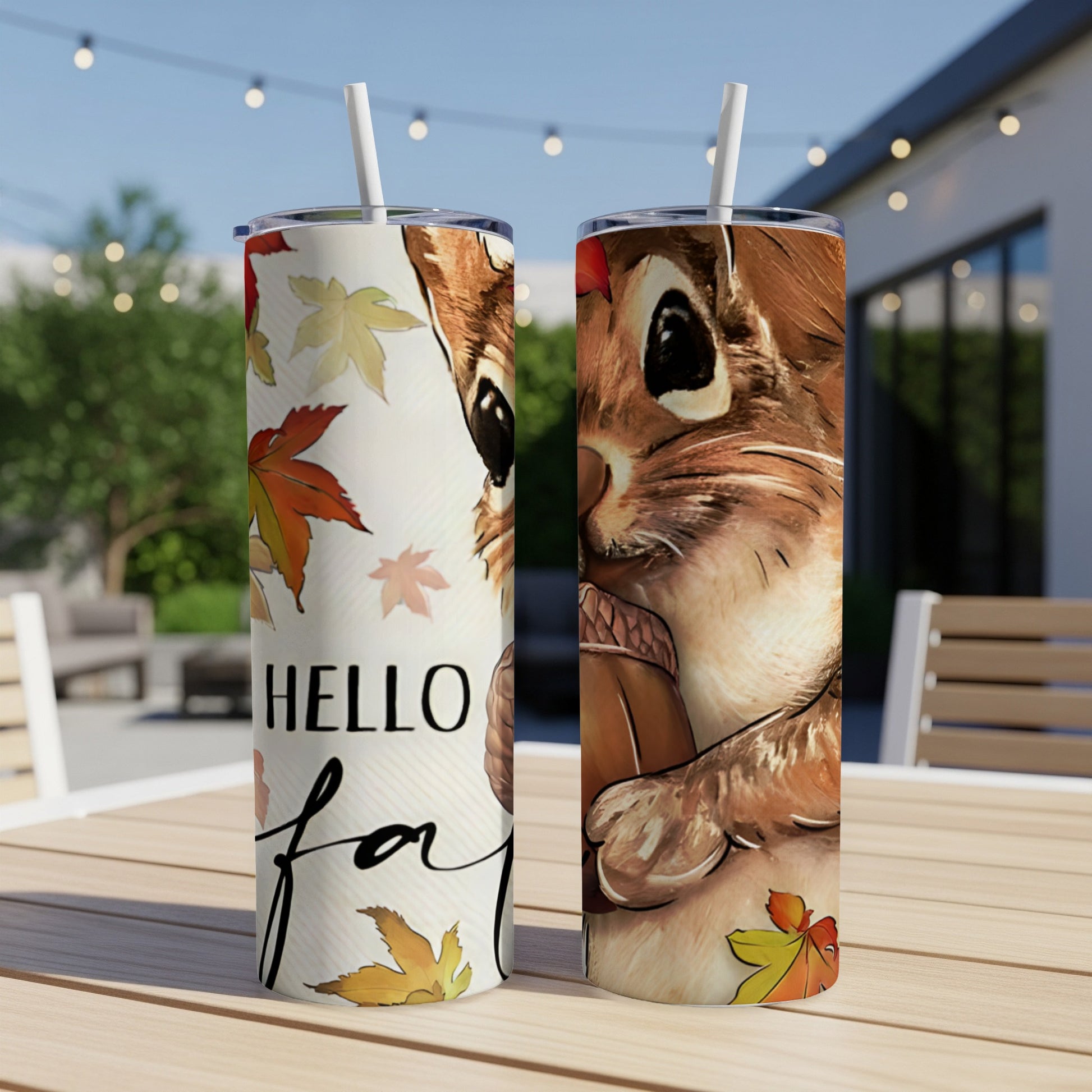 Two tumblers with squirrel and autumn leaf graphics, "Hello Fall" text.