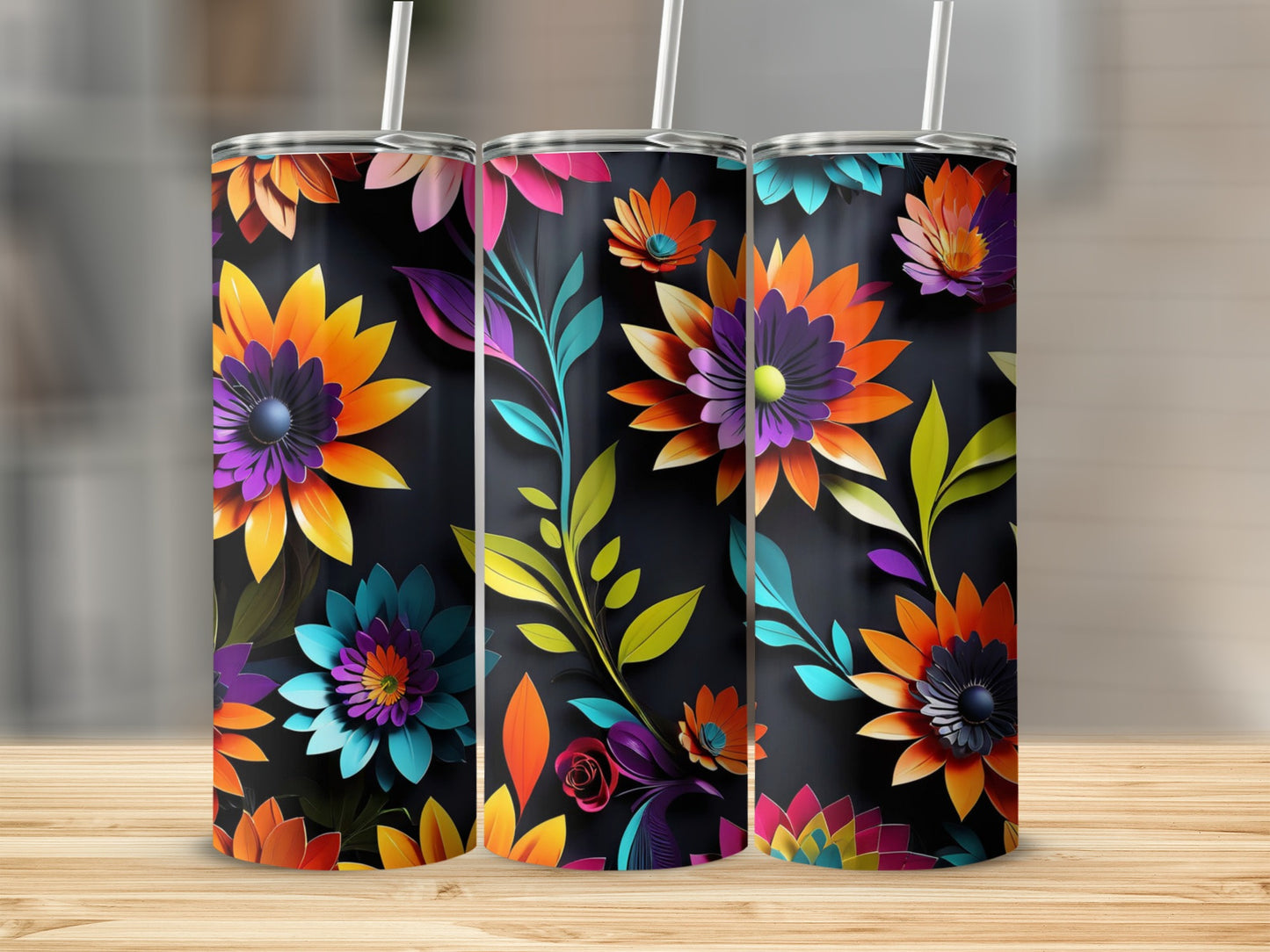 Three tumblers with a black background and vibrant, colorful floral designs.