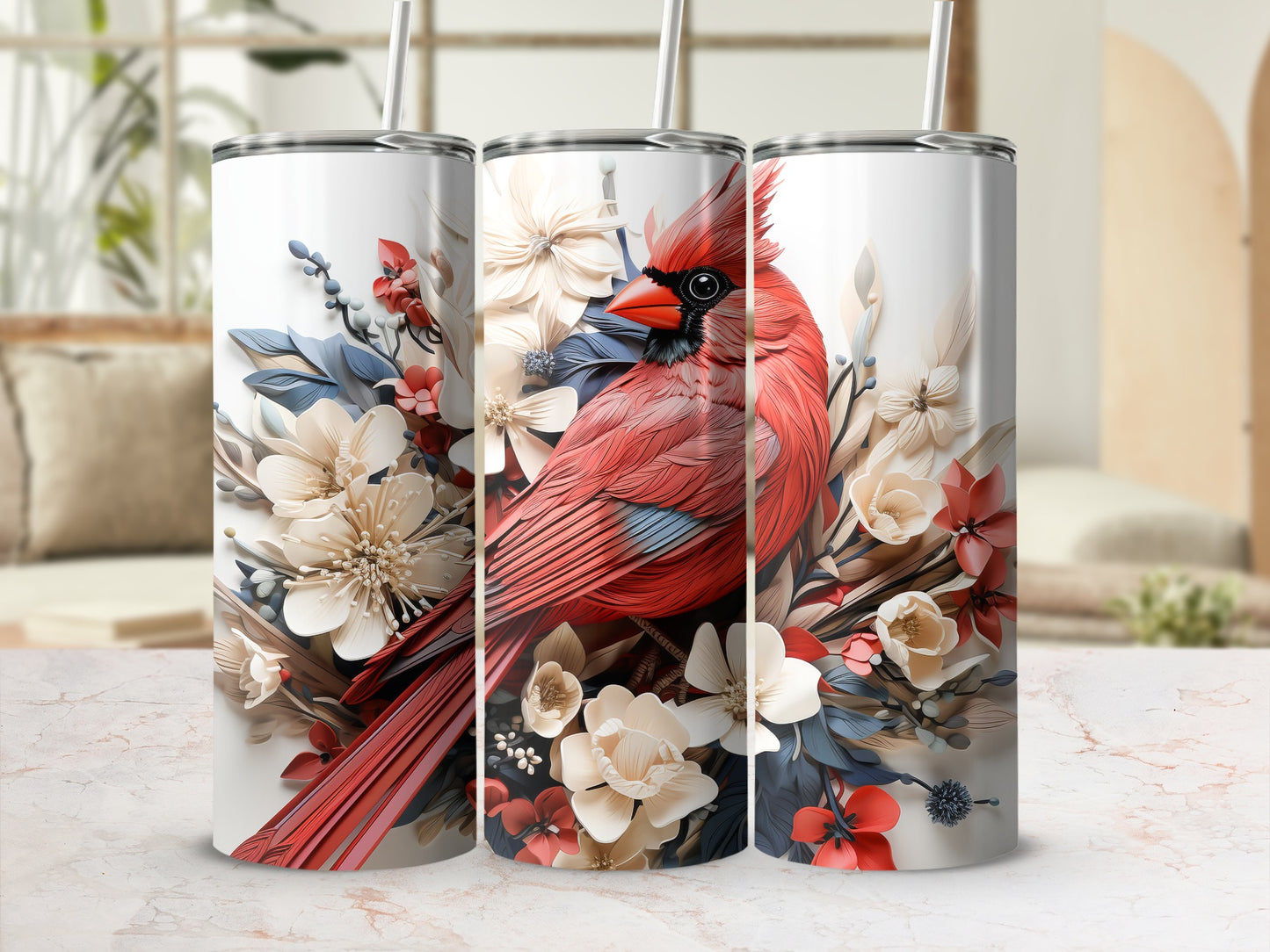 Red cardinal and floral design on three white tumblers with straws.