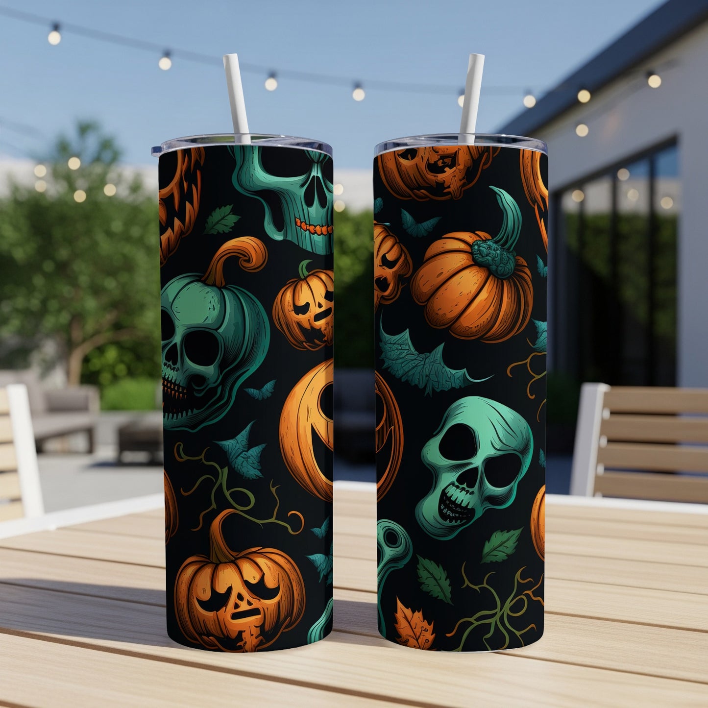 Two tumblers with a Halloween pattern of skulls and jack-o'-lanterns on a black background.