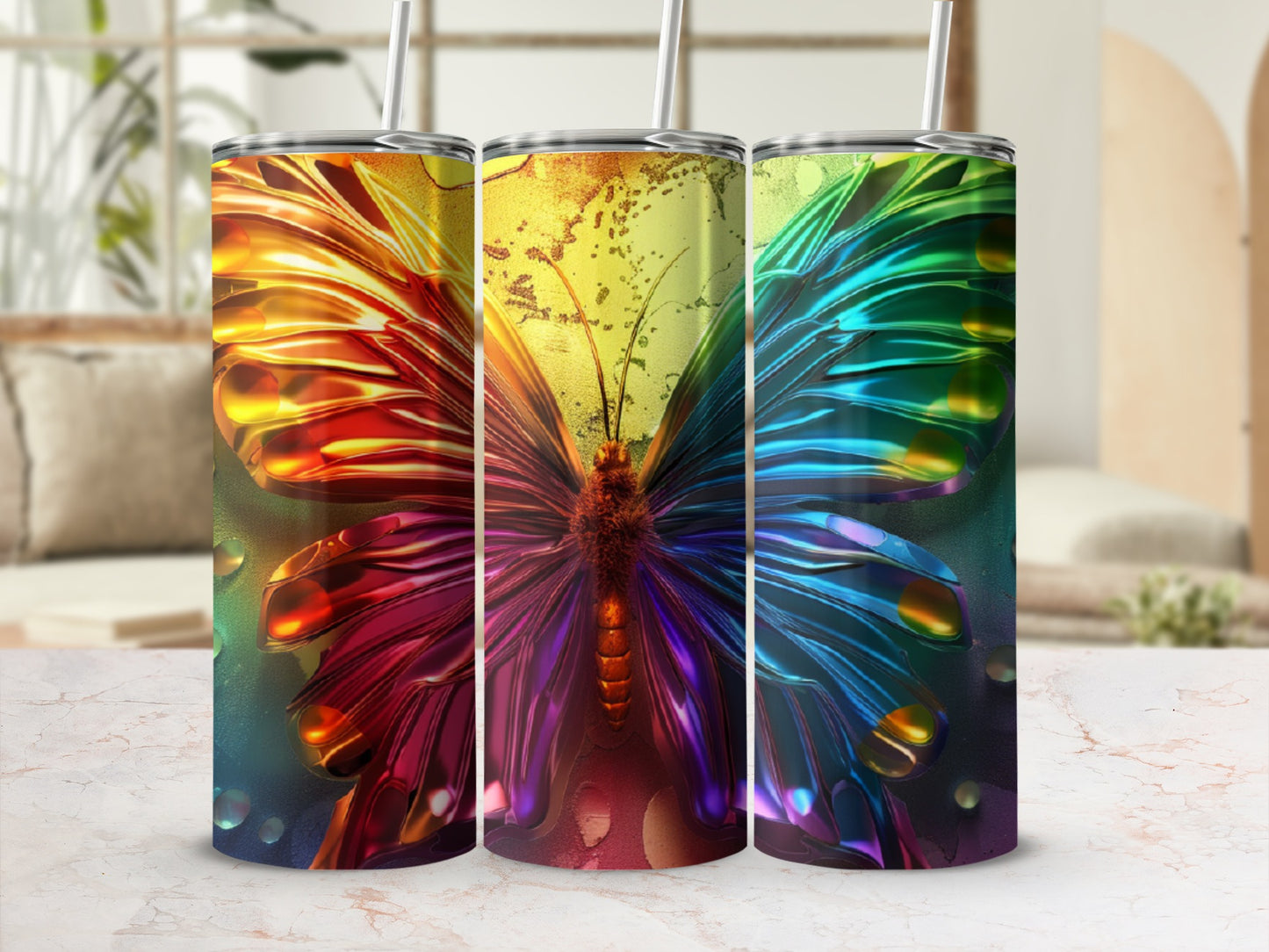 Three tumblers featuring a colorful iridescent butterfly design with metallic gold accents.