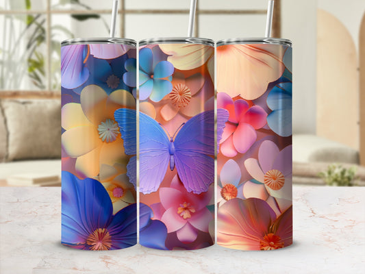Three tumblers with a floral and butterfly design, on a marble surface.