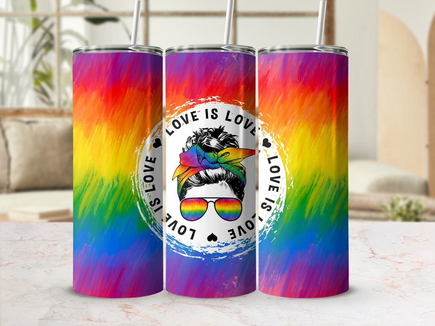 Rainbow tumbler with "Love is Love" text and a woman wearing sunglasses and a bandana.