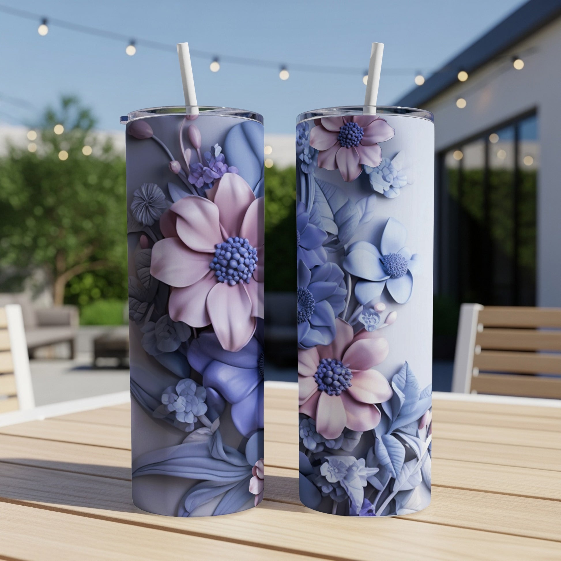 Two tall tumblers with floral designs in shades of pink and purple.